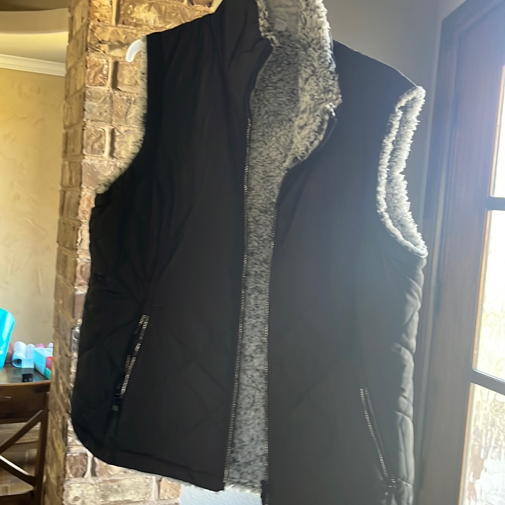Black vest with zipper pockets